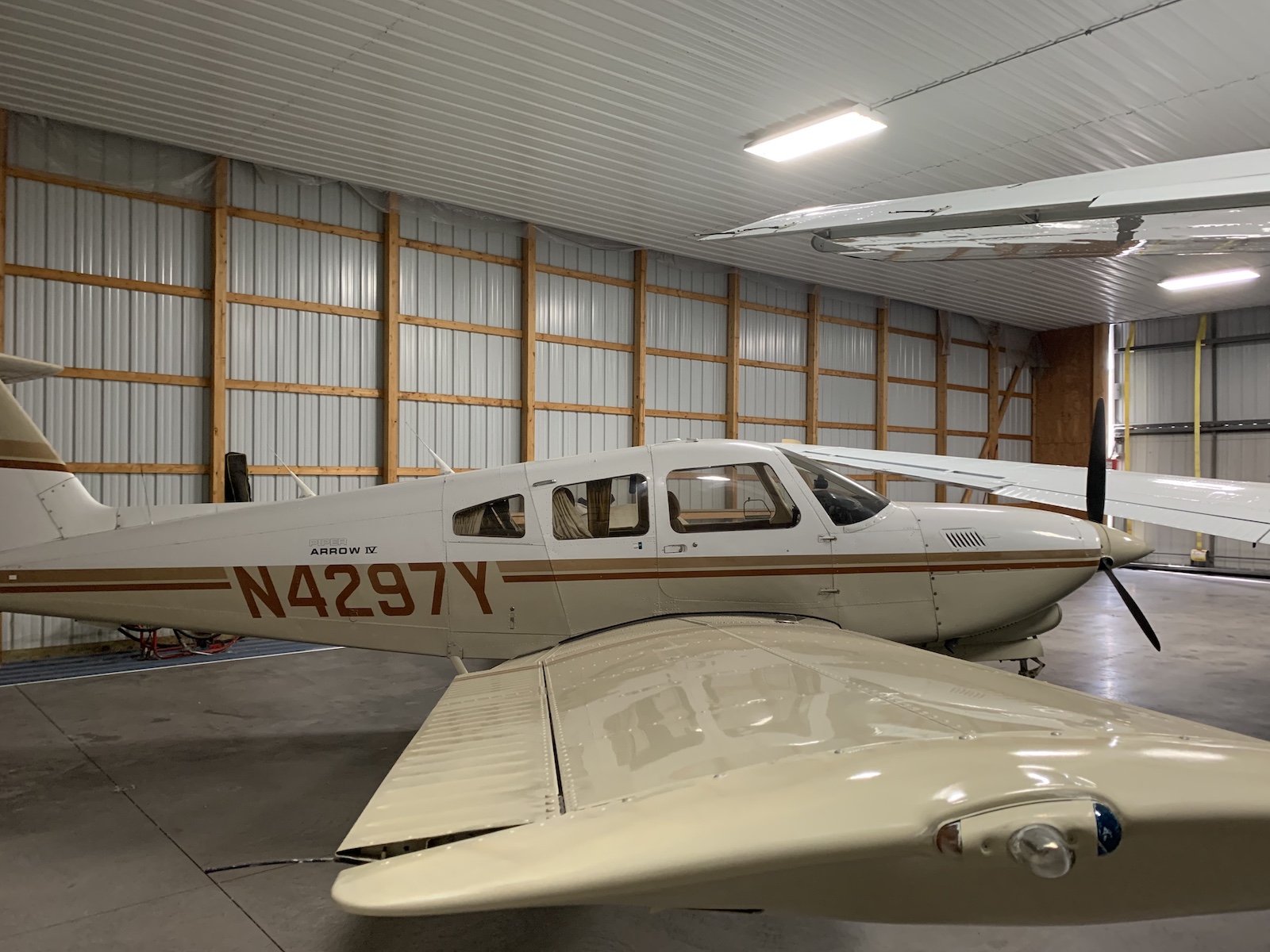Piper PA 28rt 1201t Arrow Iv inside hanger, side view