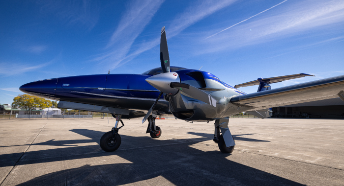 Focus on a plane casting a shadow in the afternoon with clear skies